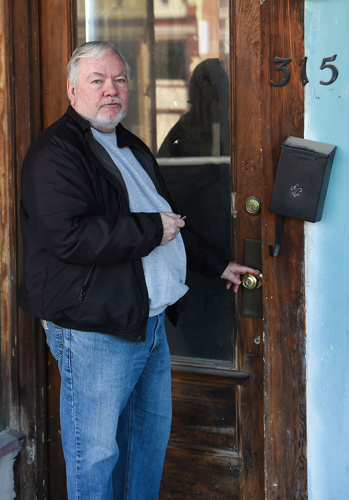 Bill Koch unlocks the door to a town building